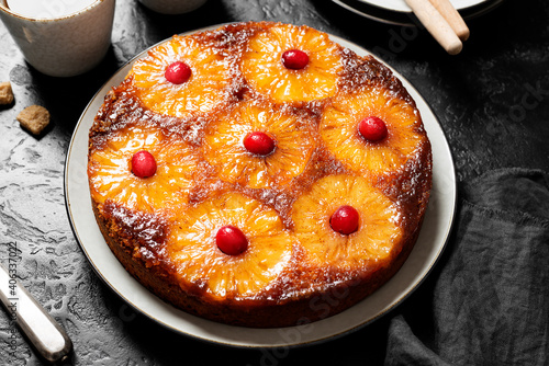 Homemade pineapple upside down pie with candied cranberry . Tropical dessert .top view. isolated on white background
