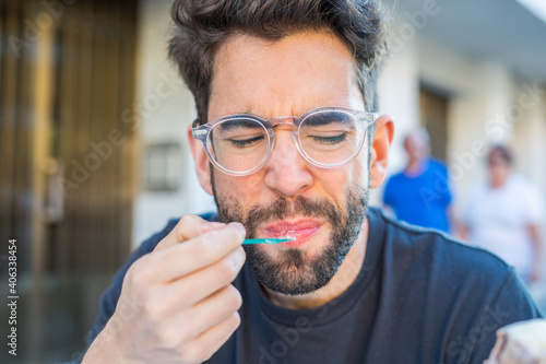 Young man eating ice cream