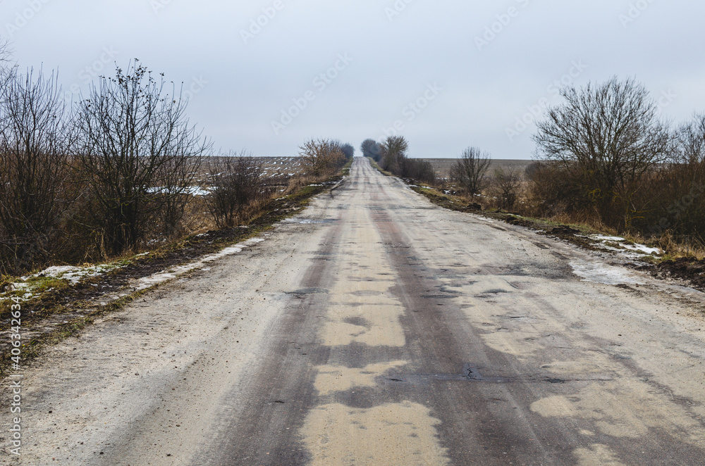 Empty winter road in Russia without snow. Warm winter due to global warming Empty winter road in Russia without snow. Warm winter due to global warming