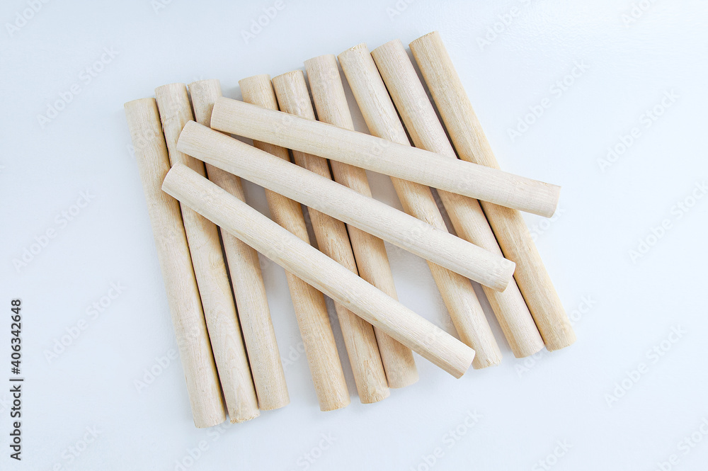 Wooden rounded blanks on white background. Garden. Wooden rounded blanks on white background. Garden.