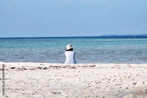 women sitting on beach