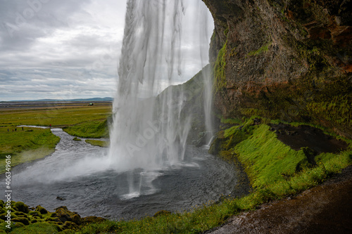 seljalandsfoss waterfall in iceland on cloudy day. 