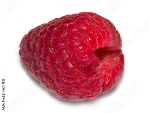 Bright red raspberry on a white background