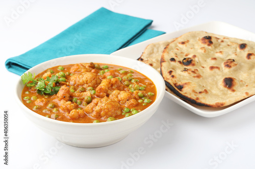 gobi mutter curry, cauliflower mutter curry, gobi masala with green peas indian food, served with roti or Chapati lunch ,dinner