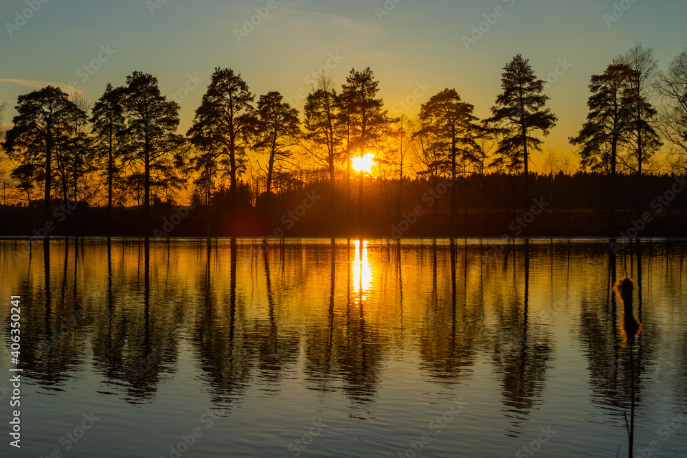 Fototapeta premium Beautiful sunset on river Kymijoki in February, Finland.