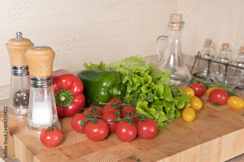 Fresh vegetables on wooden table in kitchen