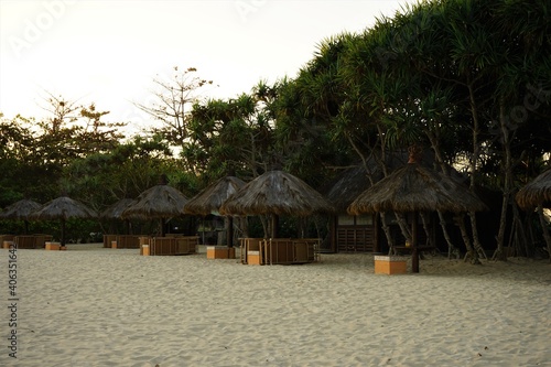 Place for beach holidays with umbrellas and chaise longue  in Nusa Dua Beach, Bali island, Indonesia © Eric Akashi