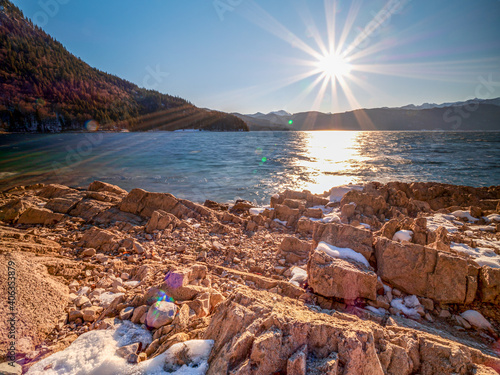 Walchensee as one of beautiest Bavarian lakes during sunrise phase with warm blue sky scenery photo