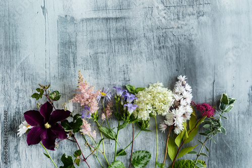 nice summer flowers on the wooden background
