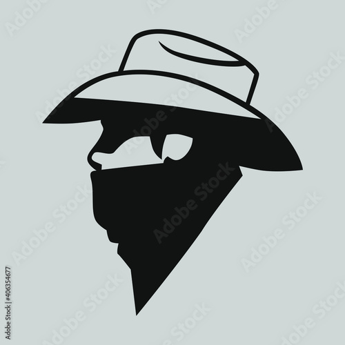 Cowboy outlaw symbol side view on gray backdrop. Design element