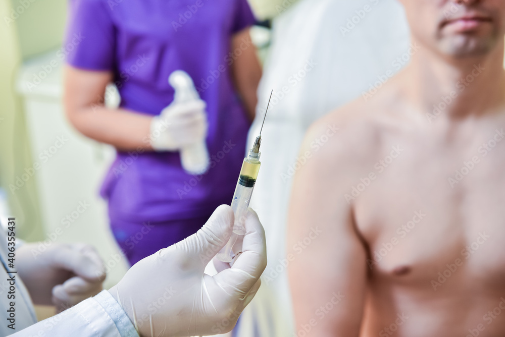 Platelet-Rich plasma preparation. Syringe with plasma in hands Platelet-Rich plasma preparation. Syringe with plasma in hands