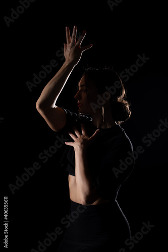 Young Woman in a black dress dancing  Young professional dancer practicing in a studio   dancer