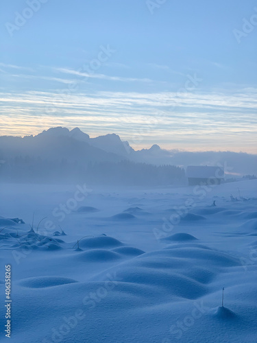 Bizarre, otherworldly winter landscape around frozen covered in ground fog