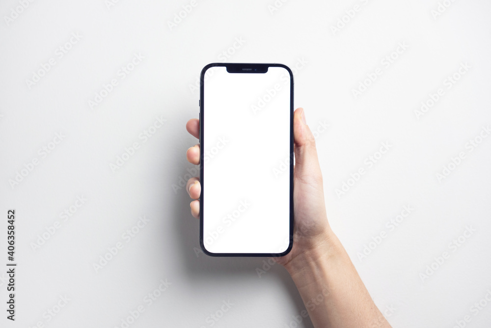 Hand holding black smartphone iPhone 12 Pro Max with white screen. Isolated  on white background. Stock-Foto | Adobe Stock