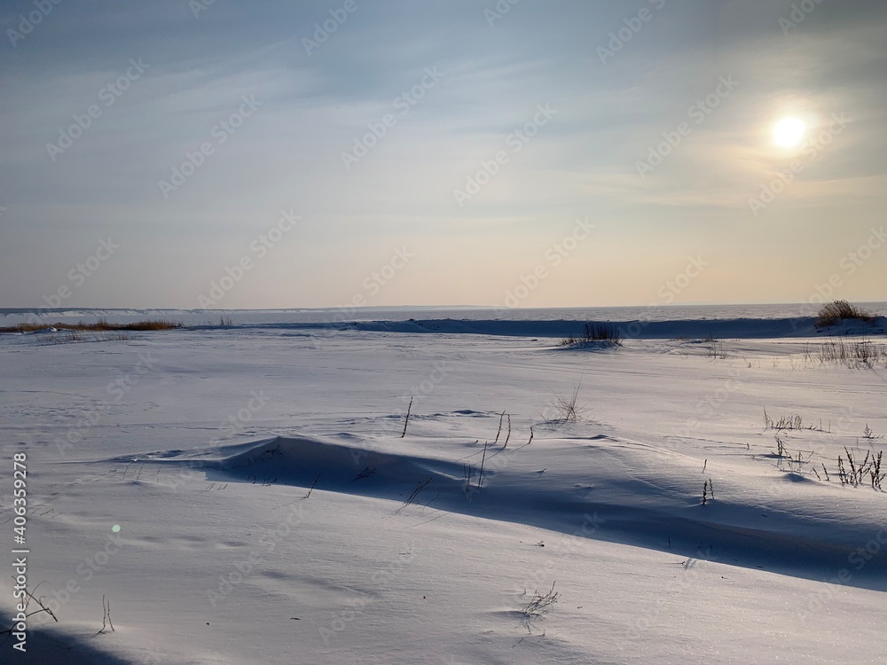 snowy ice desert in winter in the volga region 
