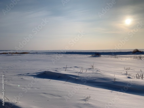 snowy ice desert in winter in the volga region 
