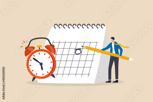 Schedule business appointment, important date, working project plan or reminder concept, smart businessman using pencil to mark important appointment date on calendar with alarm clock. photo