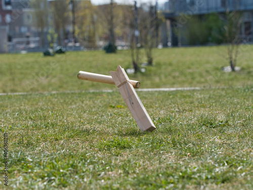 Selective focus shot of wooden pieces of traditional Viking chess on the grass-covered fiel photo