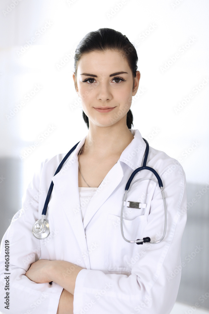 Doctor woman cheerful smiling at camera. Perfect medical service in clinic. Happy future in medicine and healthcare Doctor woman cheerful smiling at camera. Perfect medical service in clinic. Happy future in medicine and healthcare