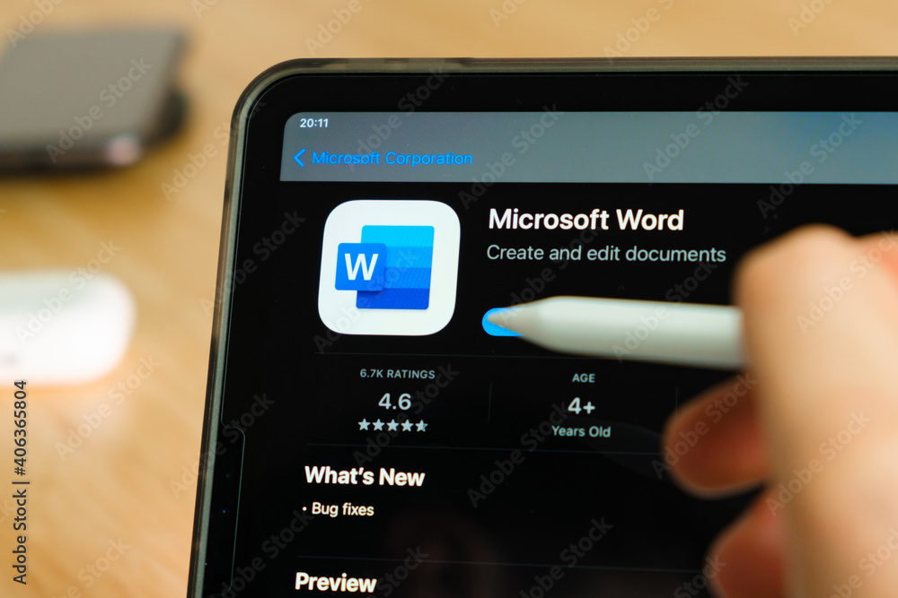 Microsoft Word logo shown by apple pencil on the iPad Pro tablet screen.  Man using application on the tablet. December 2020, San Francisco, USA.  Stock Photo | Adobe Stock