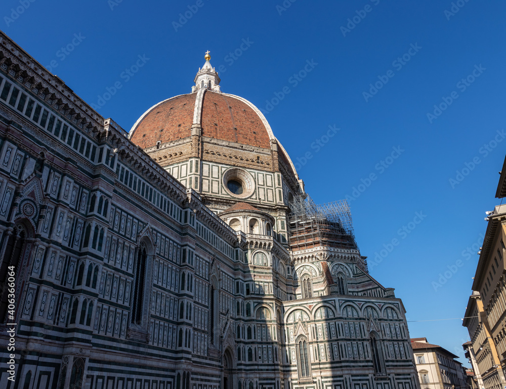 Brunelleschi's dome with scaffolding. Brunelleschi's dome against the blue sky