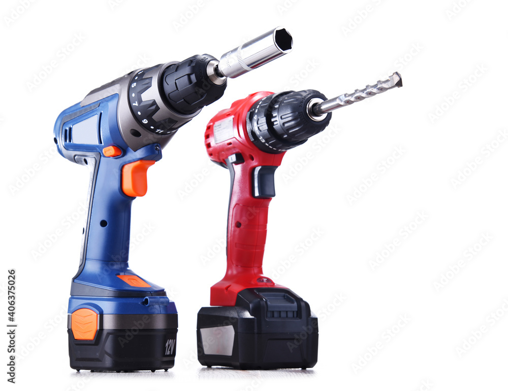 A screw gun and a pistol-grip cordless drill isolated on white A screw gun and a pistol-grip cordless drill isolated on white
