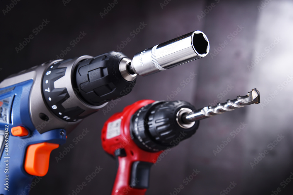 A screw gun and a pistol-grip cordless drill A screw gun and a pistol-grip cordless drill