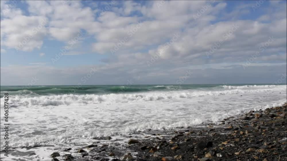 sea waves in sunny weather on a rocky shore sea waves in sunny weather on a rocky shore