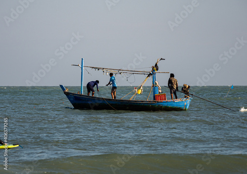 The people on the boat in sea.