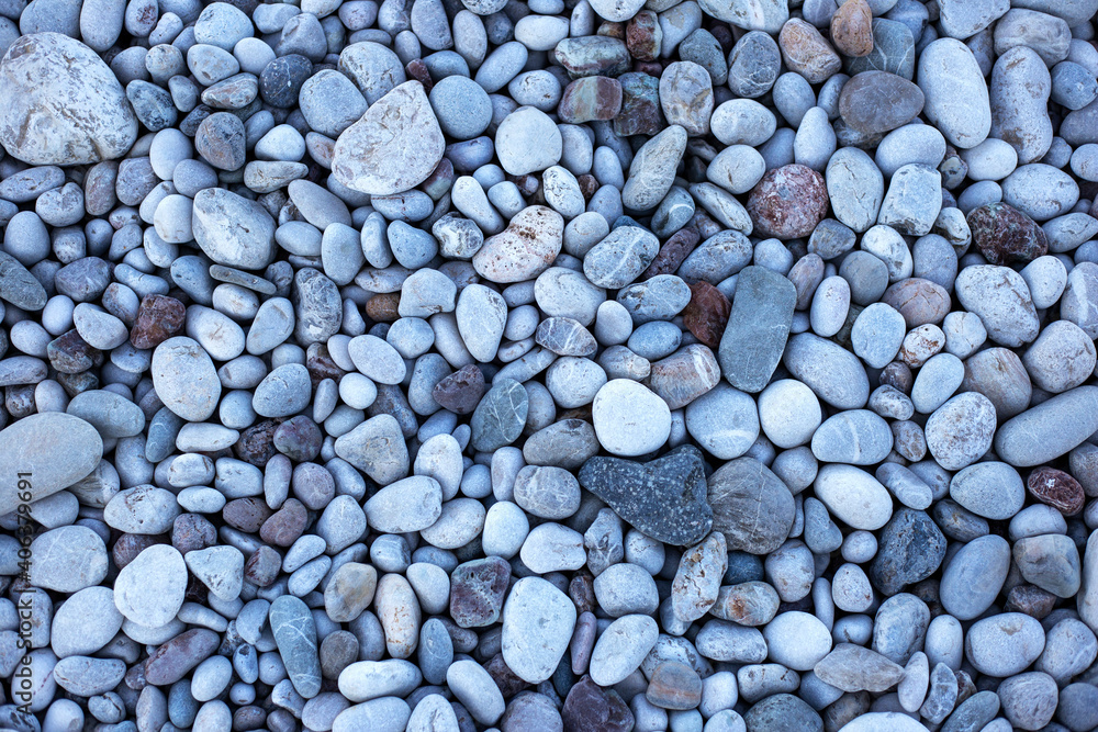 Grey pebbles and stones on the beach, top view Grey pebbles and stones on the beach, top view