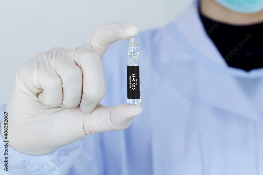 Doctor's hand holding bottle vaccine Covid-19, Medication treatment concept.