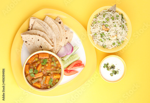 mix veg curry made from carrot, beans, and green peas served with roti, green peas pulao and curd