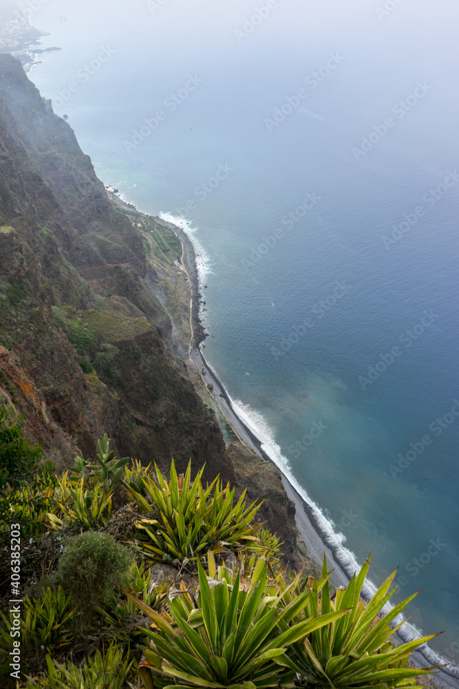 Misty Madeira Skywalk down the cliff onto the ocean