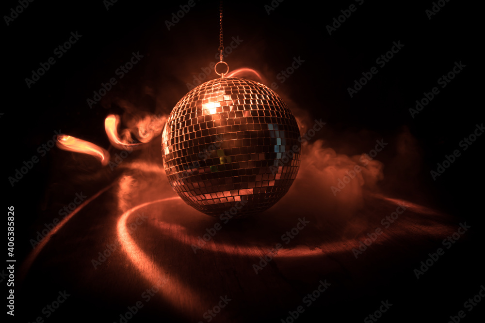 Obraz premium Colorful disco mirror ball lights night club background. Party lights disco ball. Selective focus
