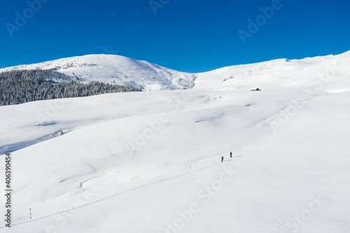 Aerial drone photograph with skier touring in Bucegi mountains, Carpathian range, Romania