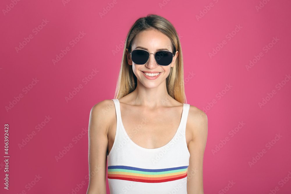 Beautiful woman in stylish sunglasses on pink background Beautiful woman in stylish sunglasses on pink background