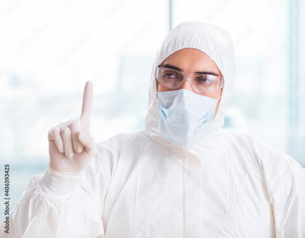 Young chemist pressing virtual buttons in lab Young chemist pressing virtual buttons in lab