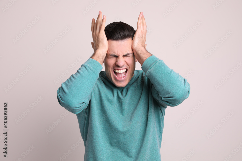 Portrait of stressed man on light background Portrait of stressed man on light background