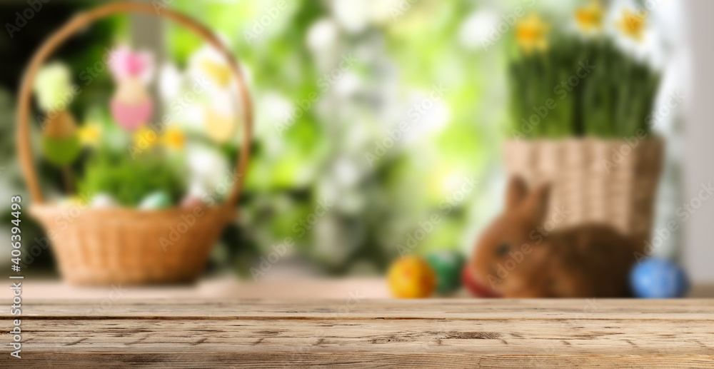 Empty wooden surface and wicker baskets with colorful Easter eggs on background. Banner design