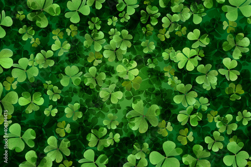 Fresh green clover leaves as background. St. Patrick's Day