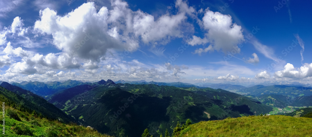 wonderful mountain landscape with clouds on the blue sky panorama