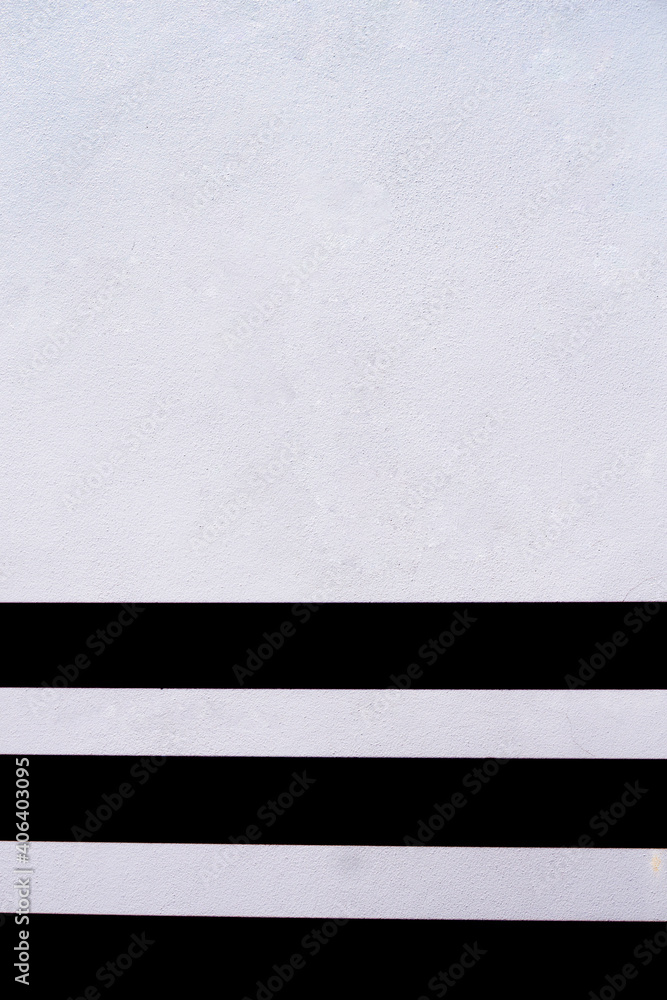 Fototapeta premium Black projected on the white cement wall