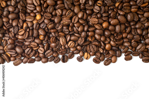 Roasted Coffee Beans background texture  isolated on white background frame on the top with copy space for text on the bottom  macro detailed photo.