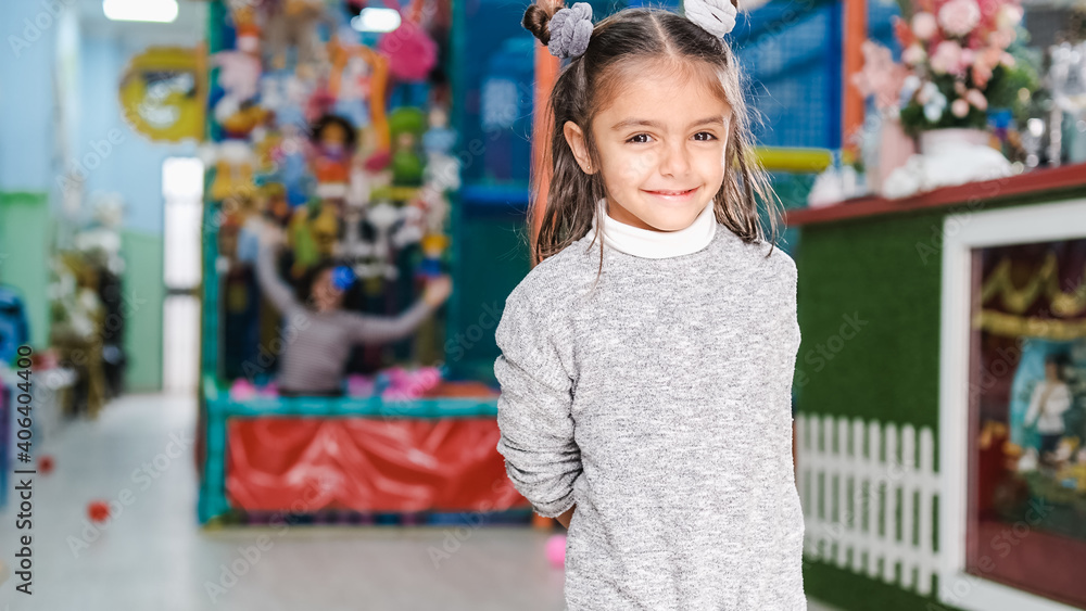 5-year-old girl smiling in children's playground 5-year-old girl smiling in children's playground