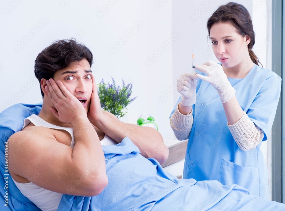 Doctor doing medical injection in hospital room Doctor doing medical injection in hospital room