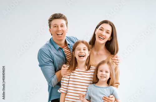 Happy family on white background. © Konstantin Yuganov