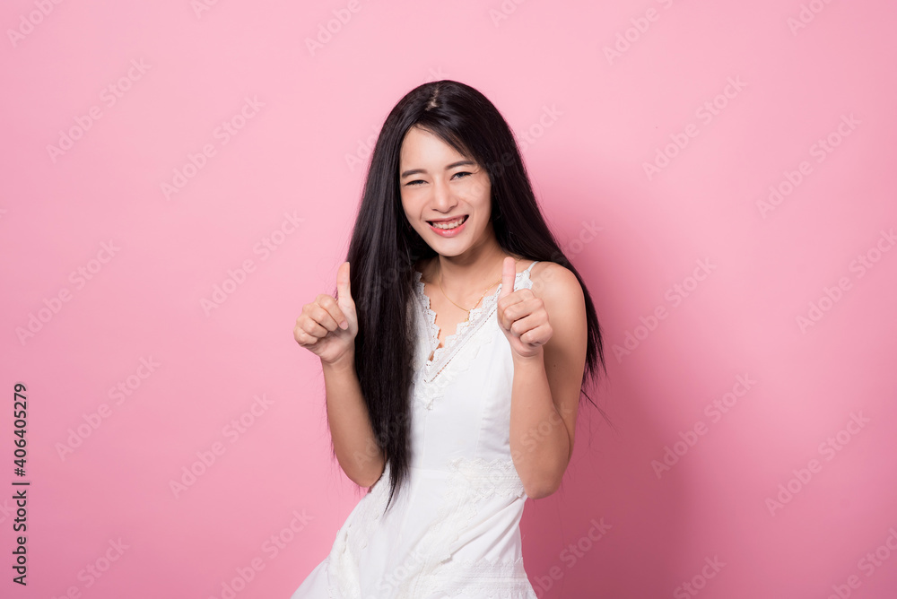 Portrait of beautiful asia young woman on Pink color background with copy space. Human face expressions, emotions feelings, body language,beauty and fashion concept. Portrait of beautiful asia young woman on Pink color background with copy space. Human face expressions, emotions feelings, body language,beauty and fashion concept.