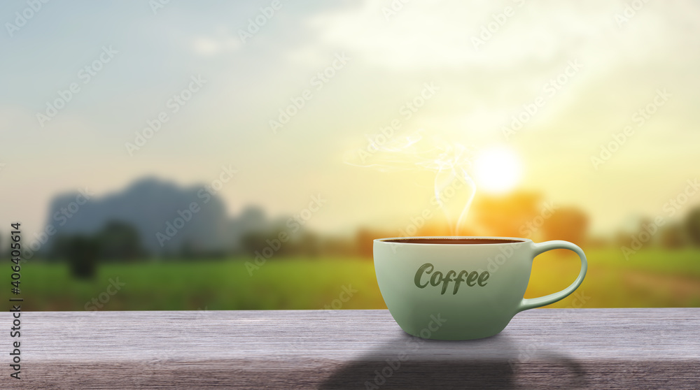A cup of hot coffee drink on an old wooden table with a green panorama nature landscape