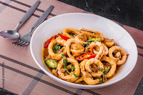 Spicy fried squid with basil leaves