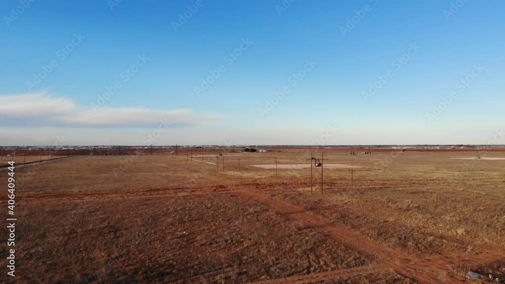 Located just outside the city of Midland, Texas there are just fields of Pumpjacks. Here is one! This shot features a far shot of the pumpjack in motion. Located just outside the city of Midland, Texas there are just fields of Pumpjacks. Here is one! This shot features a far shot of the pumpjack in motion.